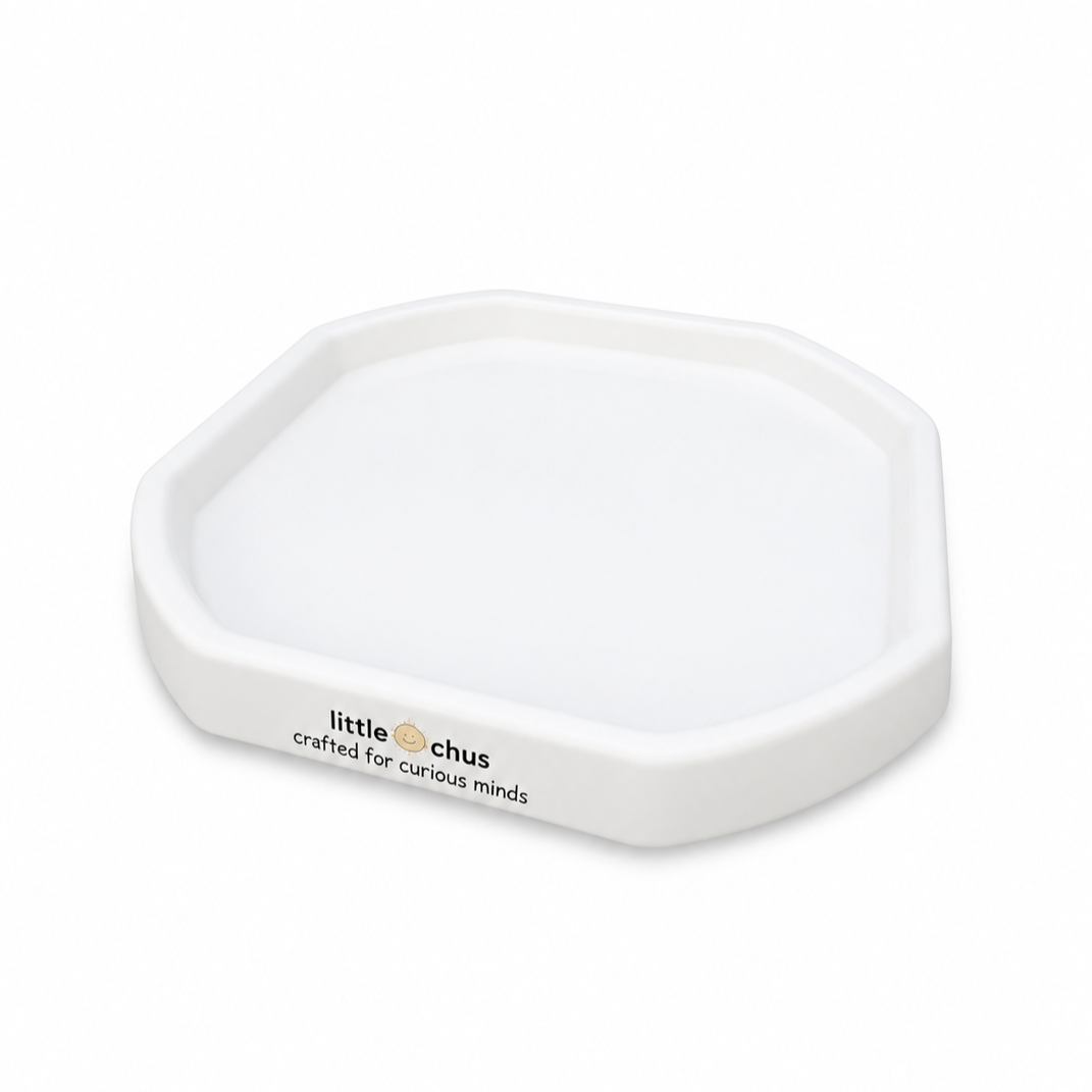 A white octagonal plastic tray with the brand name 'little chus' printed on the front, set against a clean white background.